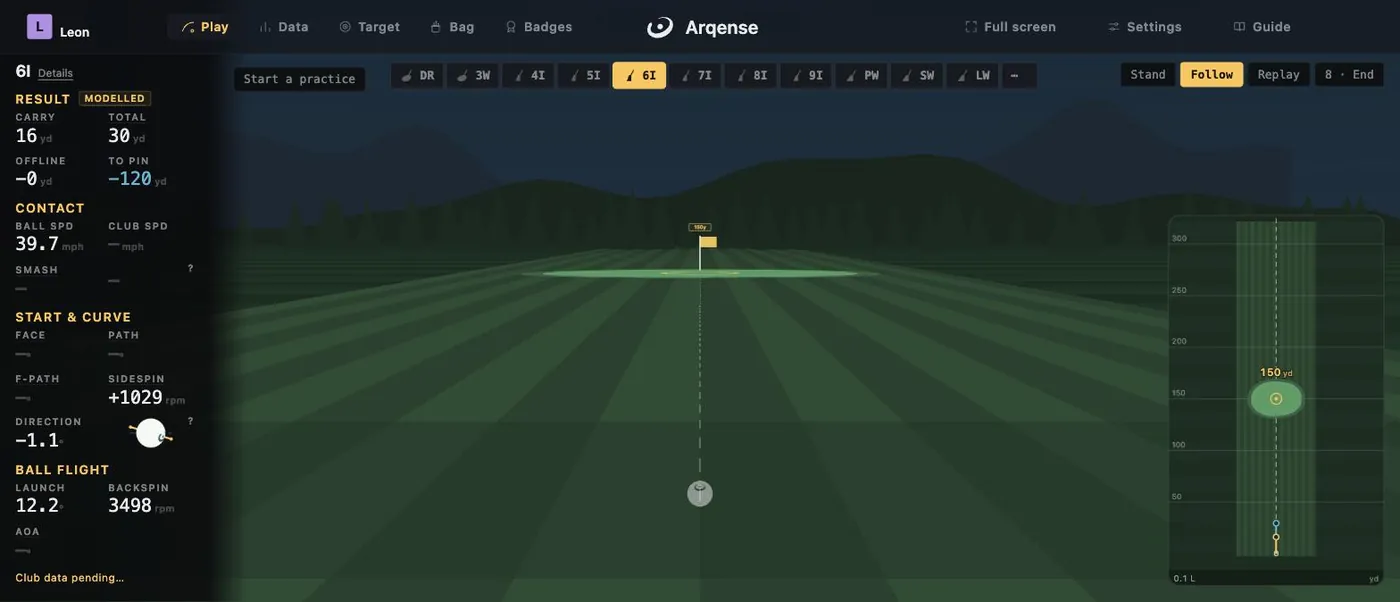The Arqense range view: shot readouts on the left, the ball on the mat and the fairway ahead
